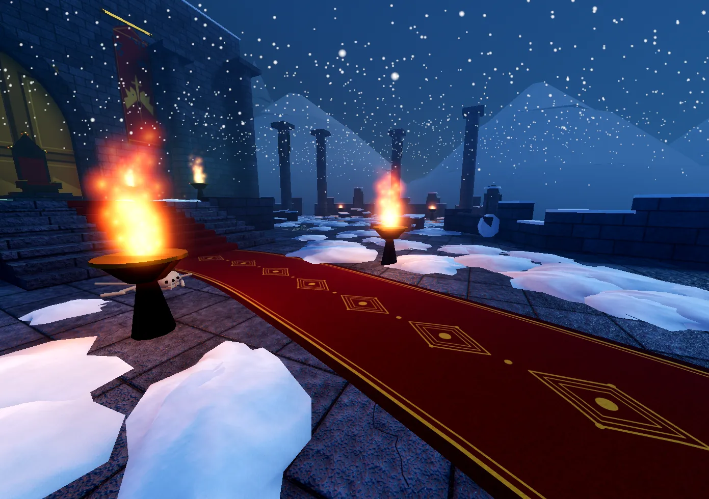 A burning torch beside the red carpet in the castle
